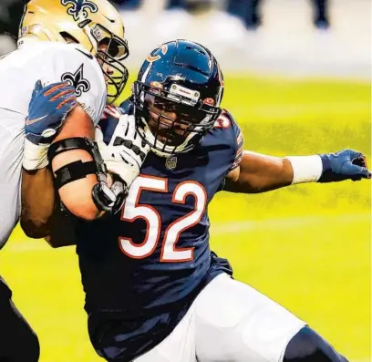  ?? JOSE M. OSORIO / CHICAGO TRIBUNE ?? Bears outside linebacker Khalil Mack tries to work his way around Saints offensive tackle Ryan Ramczyk during a 2020 game at Soldier Field.