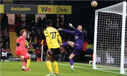  ?? ?? Josh Sargent scores Norwich’s opening goal with a back-heel volley off the underside of the crossbar to stun Watford. Photograph: Nick Potts/PA