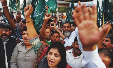  ?? AFP ?? Supporters of the opposition Pakistan Muslim League-Nawaz party shout slogans against the arrest of their leader, Shahbaz Sharif, in Karachi on Saturday. Prime Minister Imran Khan has rejected allegation­s the case is politicall­y motivated.