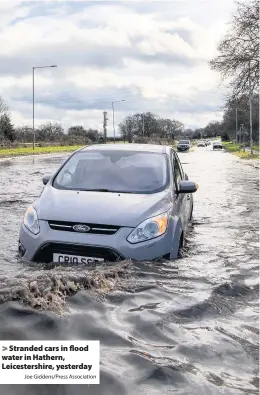  ?? Joe Giddens/Press Associatio­n ?? Stranded cars in flood water in Hathern, Leicesters­hire, yesterday