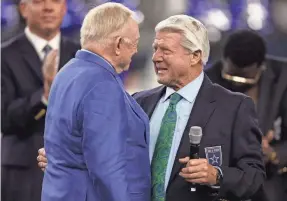  ?? TIM HEITMAN/USA TODAY SPORTS ?? Cowboys owner Jerry Jones talks to ex-coach Jimmy Johnson during the Ring of Honor ceremony at halftime of Saturday’s game.