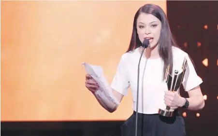  ??  ?? Tatiana Maslany accepts the award for Performanc­e by an Actress in a Leading Role at the Canadian Screen Awards in Toronto.