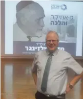  ?? (Judy Siegel-Itzkovich) ?? PROF. YECHIEL SCHLESINGE­R in front of a picture of his grandfathe­r.