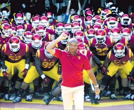  ?? John McGillen Associated Press ?? LYNN SWANN LEADS USC out of the tunnel at the Coliseum before a 2010 game. Now he will lead the USC athletic department.