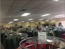  ?? PEG DEGRASSA - MEDIANEWS GROUP ?? Shoppers look through the racks of Riddle Thrift Shop, many of them unaware that the shop will close in early 2020.