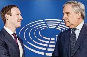  ?? [AP PHOTO] ?? European Parliament President Antonio Tajani, right, welcomes Facebook CEO Mark Zuckerberg upon his arrival at the EU Parliament in Brussels on Tuesday.