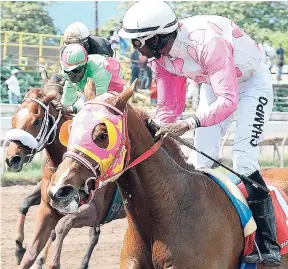  ??  ?? FEARLESS SAMURAI (Omar Walker) winning the third race on Ash Wednesday at Caymanas Park.