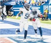  ?? AJ MAST/AP ?? Titans CB Elijah Molden (24) and LB David Long celebrate Molden’s intercepti­on return for a TD on Sunday.