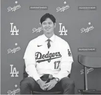  ?? ASHLEY LANDIS/AP ?? The Dodgers’ Shohei Ohtani answers questions during a news conference at Dodger Stadium on Dec. 14 in Los Angeles.