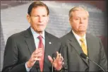 ?? Jim Watson / AFP/ Getty Images ?? Sens. Lindsey Graham, R-S.C., right, and Richard Blumenthal, D-Conn., explain Extreme Risk Protection Orders on Capitol Hill in Washington, D.C., on Thursday.