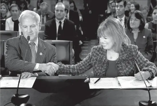  ?? Chip Somodevill­a Getty Images ?? REP. BRADLEY BYRNE (R-Ala.) joins California Democrat Jackie Speier on Tuesday before testifying at a House hearing on sexual misconduct policy in Congress.