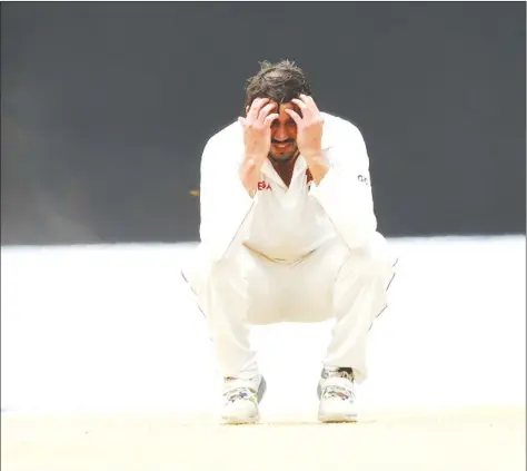  ??  ?? THIS PICTURE SAYS IT ALL . . . Zimbabwe captain Graeme Cremer buries his head in his hands after a frustratin­g final day of a thrilling Test battle against Sri Lanka in which an umpire played a huge part in the destiny of the match. — AFP