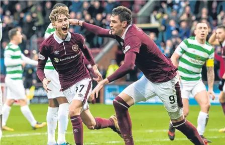  ??  ?? Harry Cochrane (left) celebrates opening the scoring in Hearts’ 4-0 win over Celtic.