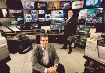  ?? Photog raphs by Mel Melcon Los Angeles Times ?? executives Otto Padron, left, and Xavier Gutierrez in the control room at the company’s new studio and broadcast center.