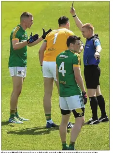  ??  ?? Conor McGill receives a black card after conceding a penalty.