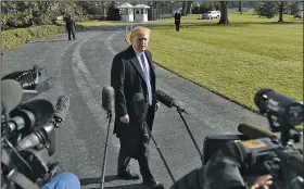  ?? AP/SUSAN WALSH ?? President Donald Trump talks with reporters Saturday before he departs from the South Lawn of the White House via Marine One in Washington to spend the weekend at Camp David in Maryland.