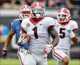  ?? CURTIS COMPTON / AJC 2017 ?? Running back Sony Michel broke his left arm in an ATV accident during the Fourth of July holiday in 2016.