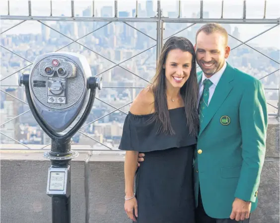  ?? Picture / AP ?? Sergio Garcia, with his fiancee Angela Akins, on top of the Empire State Building in New York, after his Masters triumph.