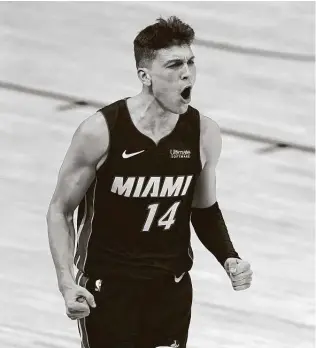  ?? Mark J. Terrill / Associated Press ?? Heat guard Tyler Herro, who scored a franchise-rookie record 37 points in Game 4, celebrates a basket. He’s just the second 20-year-old to score at least 37 points in playoff game.