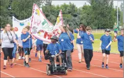  ??  ?? Children in the parade before the primary schools competitio­n at the Kent Challenger Games held at the Julie Rose Stadium