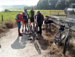  ??  ?? Below left: Elder fixes a flat tyre.