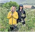  ?? ?? i Back to nature: Lizzie Frainier (left) and Hannah foraging in the surroundin­g fields