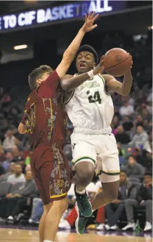  ?? D. Ross Cameron / Special to The Chronicle ?? Kyree Walker (right) helped Moreau Catholic reach the state Division II title game, but will transfer to an Arizona school.