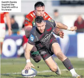  ??  ?? Gareth Davies inspired the Scarlets with a try brace
