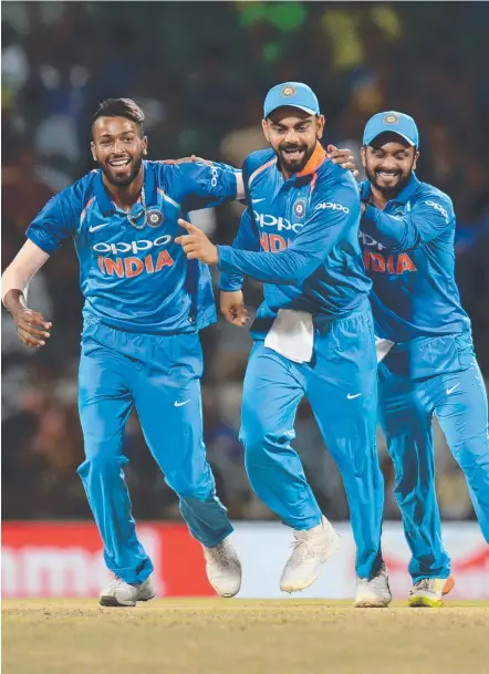  ?? ONE- UP: Indian cricketer Hardik Pandya ( left) celebrates the wicket of Australian cricket captain Steven Smith. ??