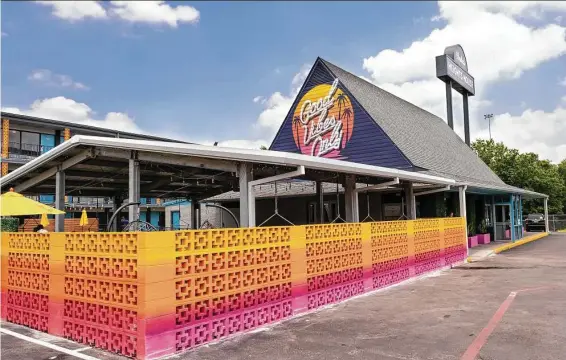  ?? Photos by Dylan McEwan ?? A concrete block “color bomb wall” provides privacy at the outdoor pavilion.