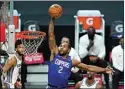  ?? ASHLEY LANDIS / AP ?? Clippers forward Kawhi Leonard (2) dunks during the first quarter of Wednesday’s game against the Kings in Los Angeles. The Clippers led 108-93 at The California­n’s press deadline.