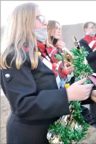  ??  ?? Pea Ridge Band students participat­ing in the annual Christmas parade included Mahayla Bettis, Stella Kiesel and Tristen Williams.