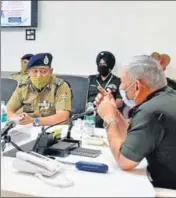  ?? HT PHOTO ?? Chief of Defence Staff General Bipin Rawat General Bipin Rawat (right) during a meeting with state police officers in Dehradun on Tuesday.