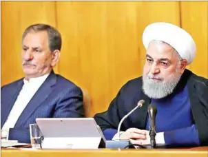  ?? HANDOUT FROM IRANIAN PRESIDENCY/AFP ?? Iranian President Hassan Rouhani (right) and First Vice President Eshaq Jahangiri attend a cabinet meeting in Tehran on Wednesday.