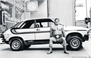  ??  ?? Wrestler Count Bartelli was a favourite of the young Terry Church, but he was still in the game years later. Here he is in 1980 lifting an Austin Allegro, by which time he had been unmasked as Geoff Condliffe
