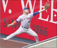  ?? JOHN MINCHILLO - THE ASSOCIATED PRESS ?? New York Mets right fielder Michael Conforto misses a triple hit by New York Yankees’ DJ LeMahieu off starting pitcher Robert Gsellman in the third inning of a baseball game, Saturday, Aug. 29, 2020, in New York.