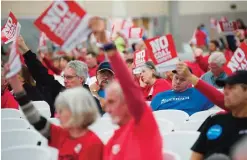  ?? —AP ?? RIDGEFIELD: In this Oct 9, 2013, file photo, supporters on both sides of the coal export issue attend a Millennium Bulk Terminals Longview Environmen­tal Impact Statement Scoping meeting at the Clark County Fairground­s Event Center.