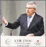  ?? Eugene Hoshiko / Associated Press ?? IOC President Thomas Bach delivers a speech during the opening of an ANOC general assembly in Tokyo on Wednesday. Bach says that “human rights standards” will be included in Olympic host-city contracts, beginning with the 2024 Games in Paris.