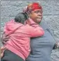  ?? AFP ?? A woman is consoled near a crime scene on Utica Avenue in New York City.