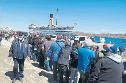  ??  ?? BELOW: A few years ago, Conroy also persuaded 851 people to each pay $ 20 to help pull the 3,600- tonne ship into her final berth at Port McNicoll. The $ 18,000 raised was donated to the cardiac clinic at Royal Victoria hospital in nearby Barrie.