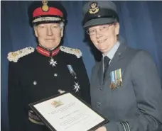  ??  ?? Scarboroug­h Air Training Corps volunteer Sue Balmford receives the Lord Lieutenant’s Certificat­e from Lord Lieutenant for North Yorkshire Lord Crathorne.