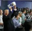  ?? EVAN VUCCI — THE ASSOCIATED PRESS FILE ?? In this file photo, President Donald Trump tosses paper towels into a crowd at Calvary Chapel in Guaynabo, Puerto Rico.