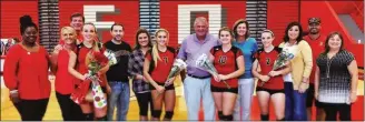  ??  ?? The veterans of the Lady Warriors, including (from left) Rachel Harwood, Hope LaFerry, Leah Oliver and Sydni Eaves recently celebrated senior night at LFO with (right) head coach Dianne Norwood and their parents. (Contribute­d photo)