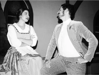 ?? RICHARD HUTTON NIAGARA THIS WEEK ?? Adrianna Polito, as Belle, and Bryn Dewar as Gaston in a scene from Garden City Production­s production of Disney’s Beauty and the Beast, which begins its run at the Mandeville Theatre at Ridley College on Nov. 16.
