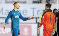  ?? MARTIN RICKETT POOL/AFP VIA GETTY IMAGES ?? Tottenham Hotspur goalkeeper Joe Hart, left, talks to Marine goalkeeper Bayleigh Passant after Sunday’s game.