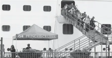  ??  ?? Passengers of the Emerald Princess cruise ship disembark Wednesday in Juneau, Alaska, hours after arriving at port.