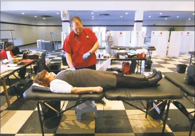  ?? Christian Abraham / Hearst Connecticu­t Media ?? University of Bridgeport Event Coordinato­r Denise Brady donates blood during a Red Cross blood drive held at the school's student center in Bridgeport on Jan. 24, 2018.