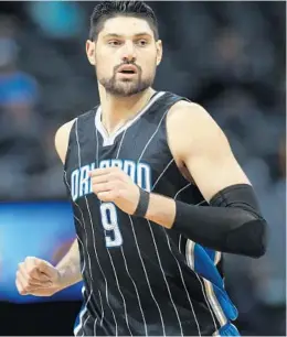  ?? DAVID ZALUBOWSKI/ASSOCIATED PRESS ?? Nikola Vucevic has collected 30.5 percent of available defensive rebounds when he’s been on the floor this season — the highest percentage of his career.