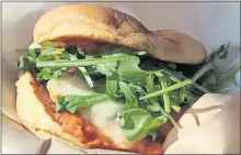  ?? [DAVE CATHEY/ THE OKLAHOMAN] ?? Burger Pig is named for this one, which includes pork patty, Manchego cheese, arugula, red onions and bacon tomato jam.