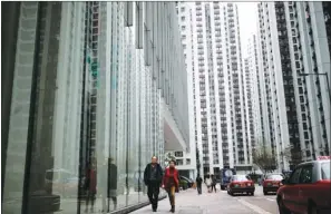  ?? EDMOND TANG / CHINA DAILY ?? A view of properties in Tai Koo Shing, a popular community of the city’s middle class. Chief Executive Leung Chun-ying called for long-term efforts to tackle the city’s long-lasting housing problem by future administra­tions.